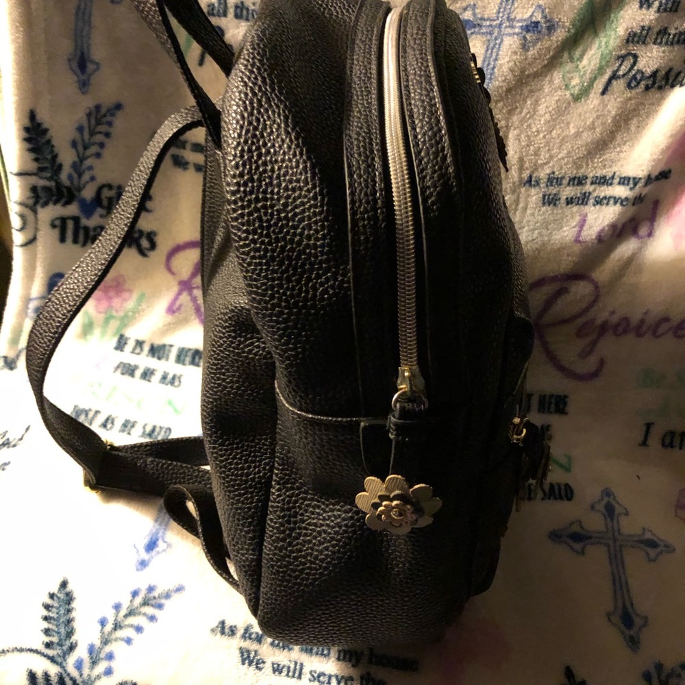 EUC Black with Beige Flowers “Reaction” Backpack - Picture 2 of 4